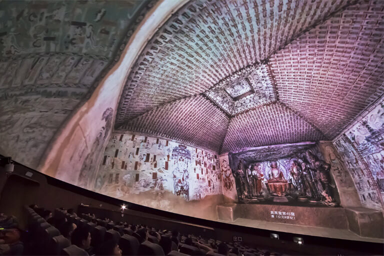 Watch a documentary film in the Dome Theater of Mogao Grottoes Digital Exhibition Center