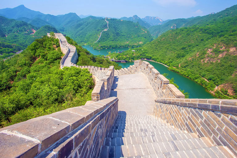 Huanghuacheng Great Wall rises up from a beautiful lake